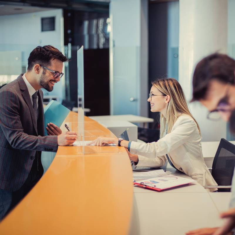 Happy customers in a banking branch.